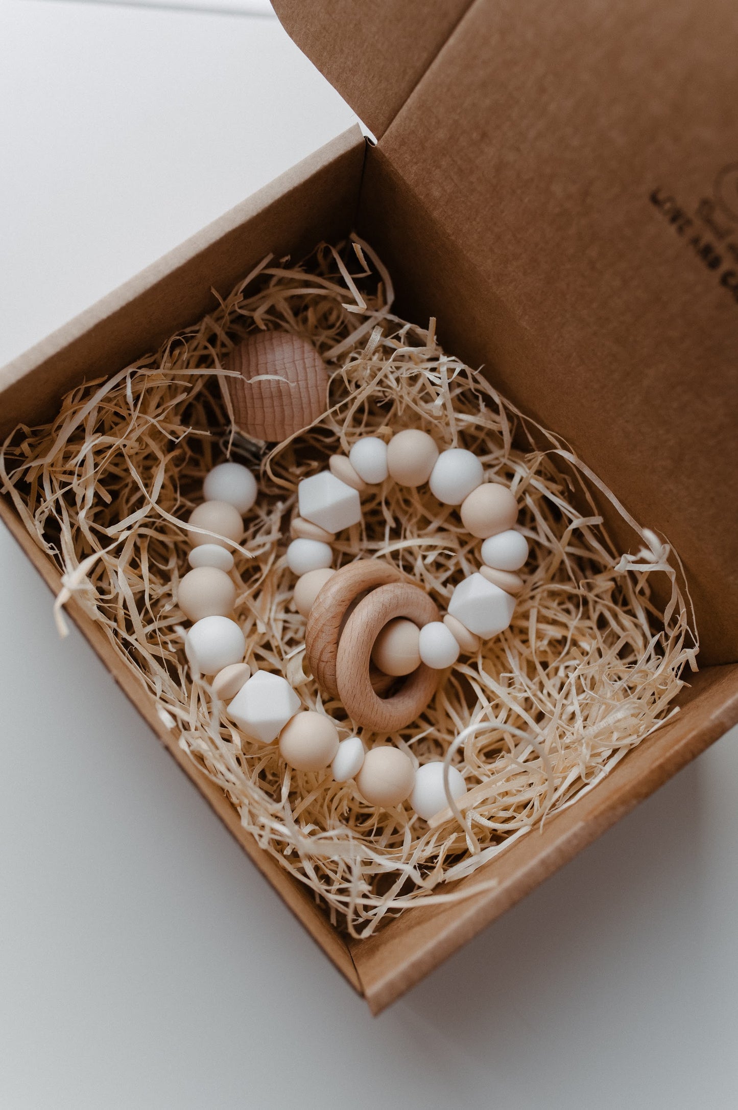 Pacifier holder and teething ring