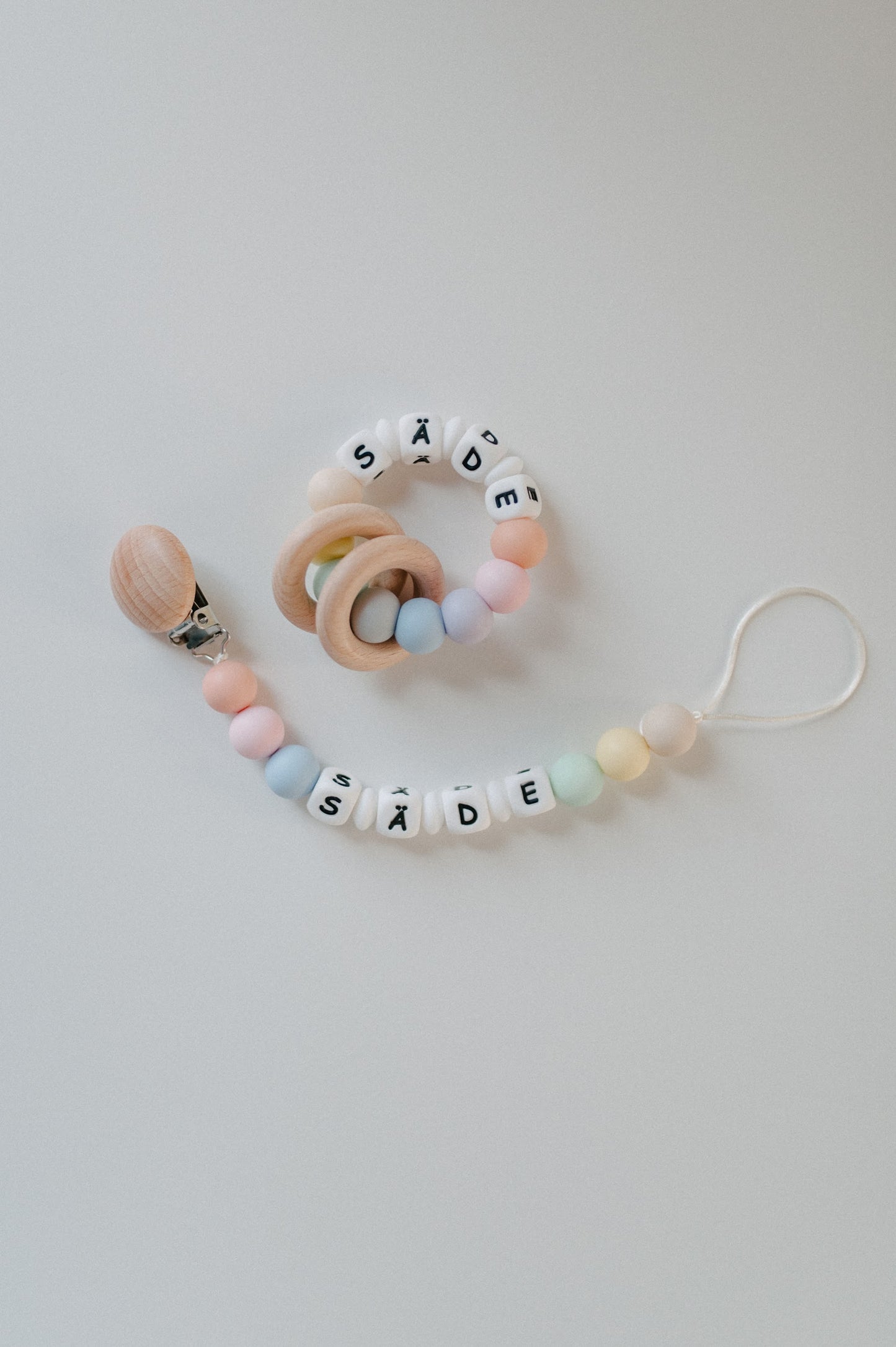 Personalized pacifier holder and personalized teething ring