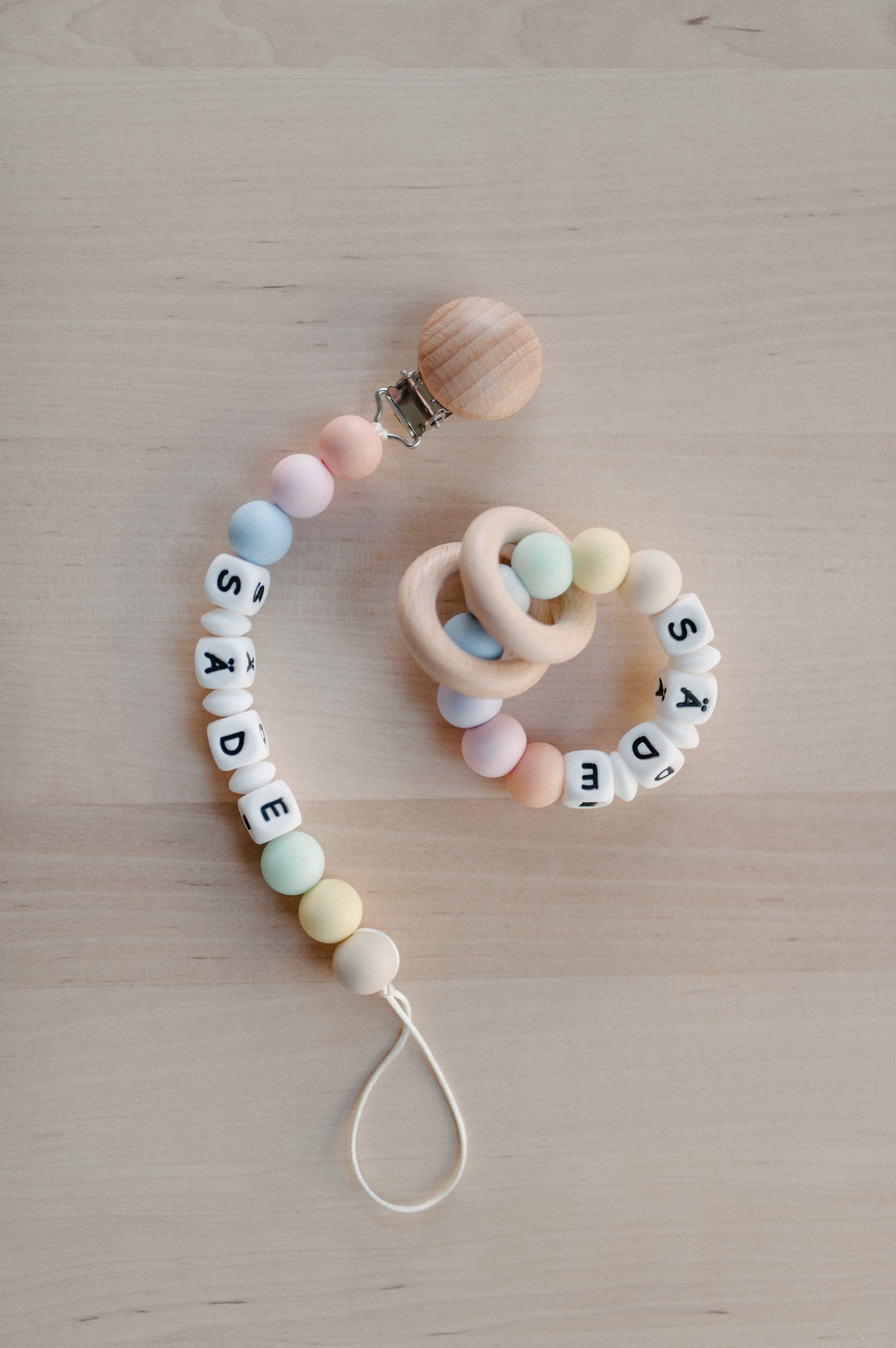 Personalized pacifier holder and personalized teething ring