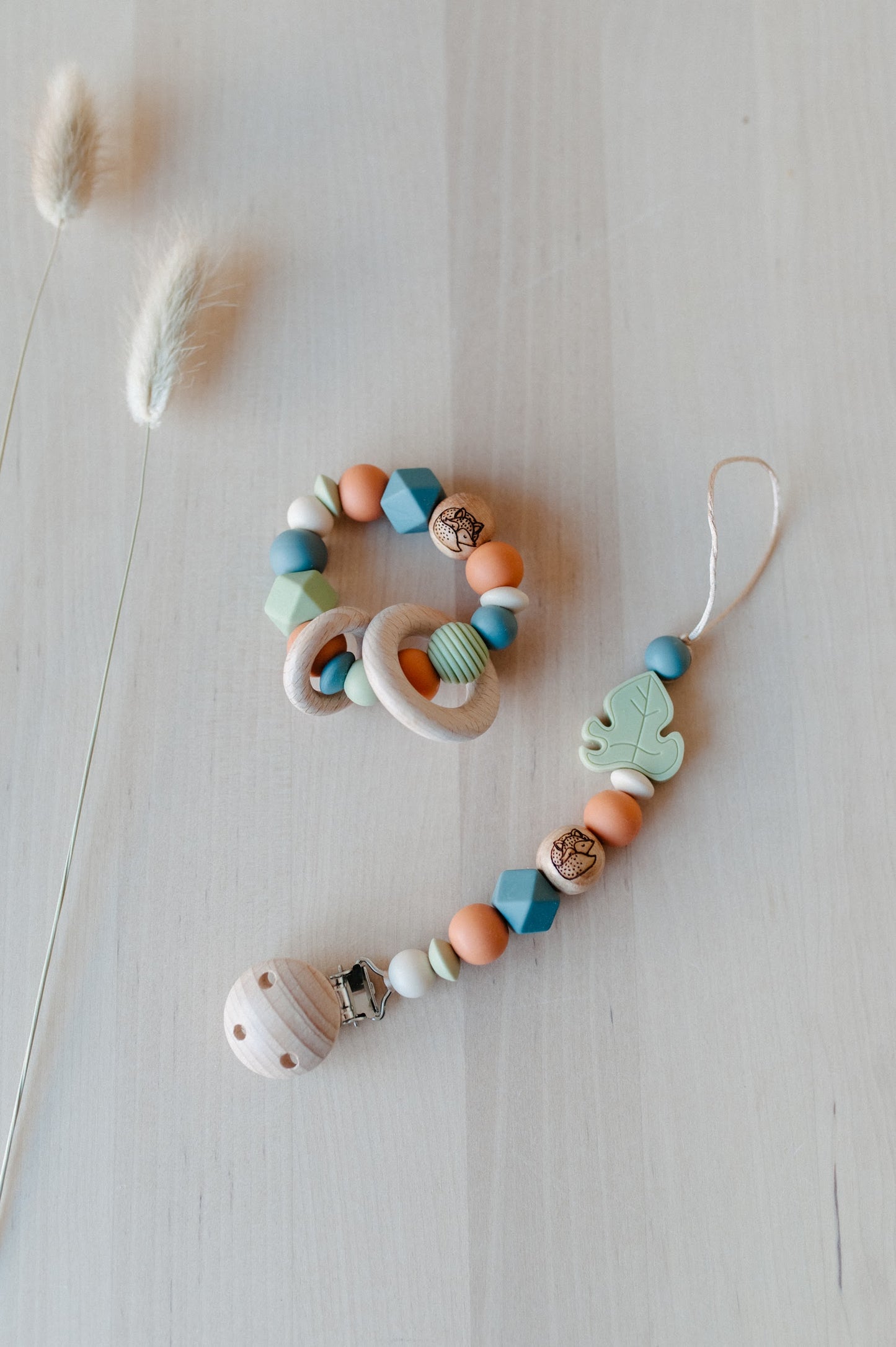 Pacifier holder and teething ring