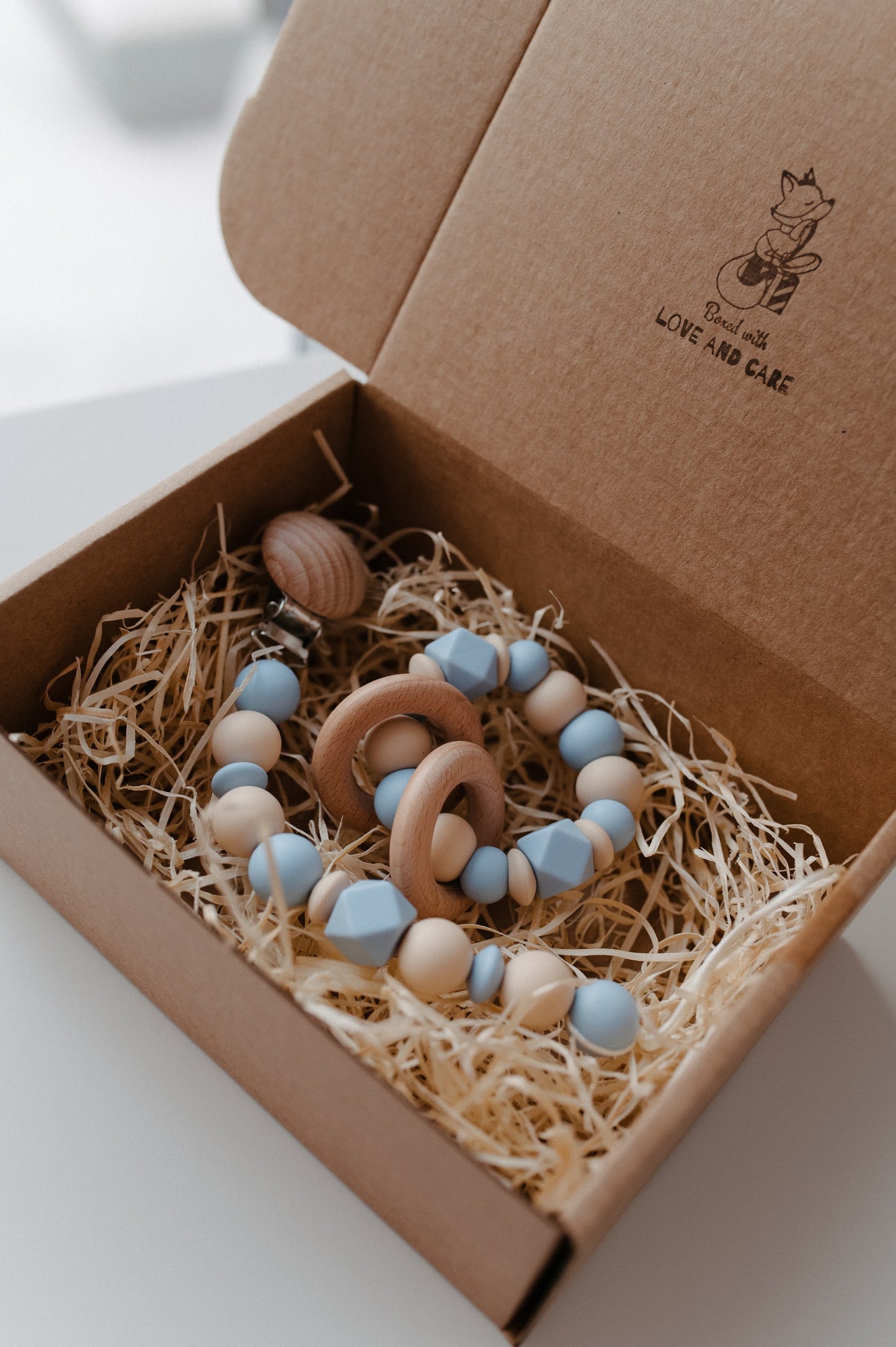 Pacifier holder and teething ring