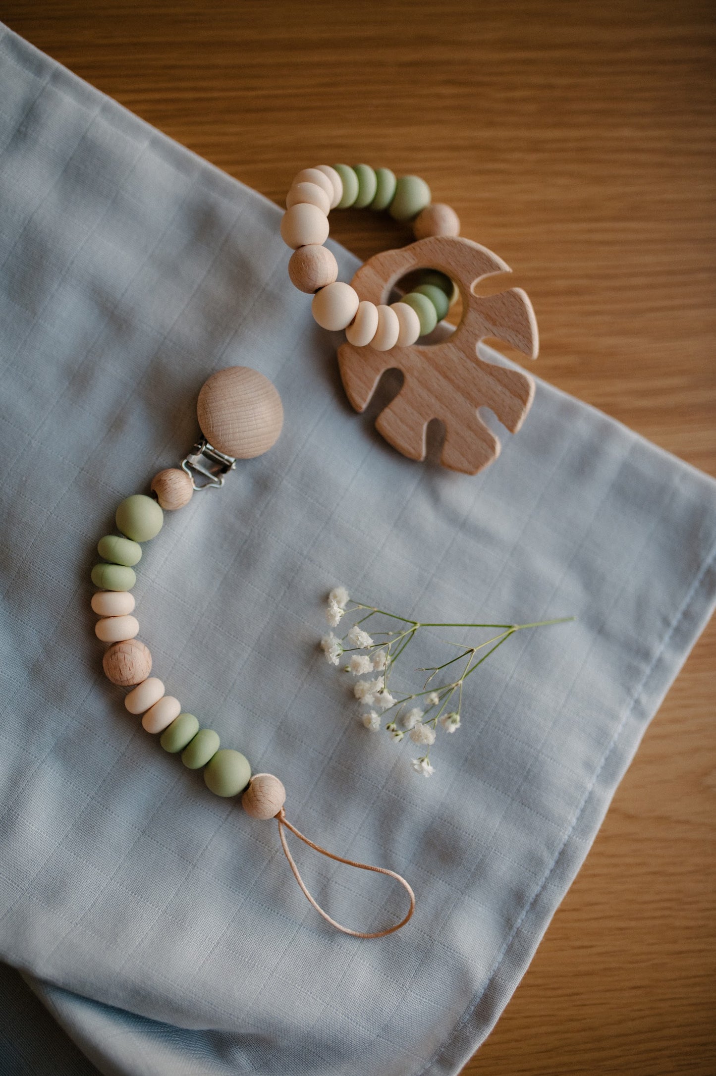 Pacifier holder and teething ring