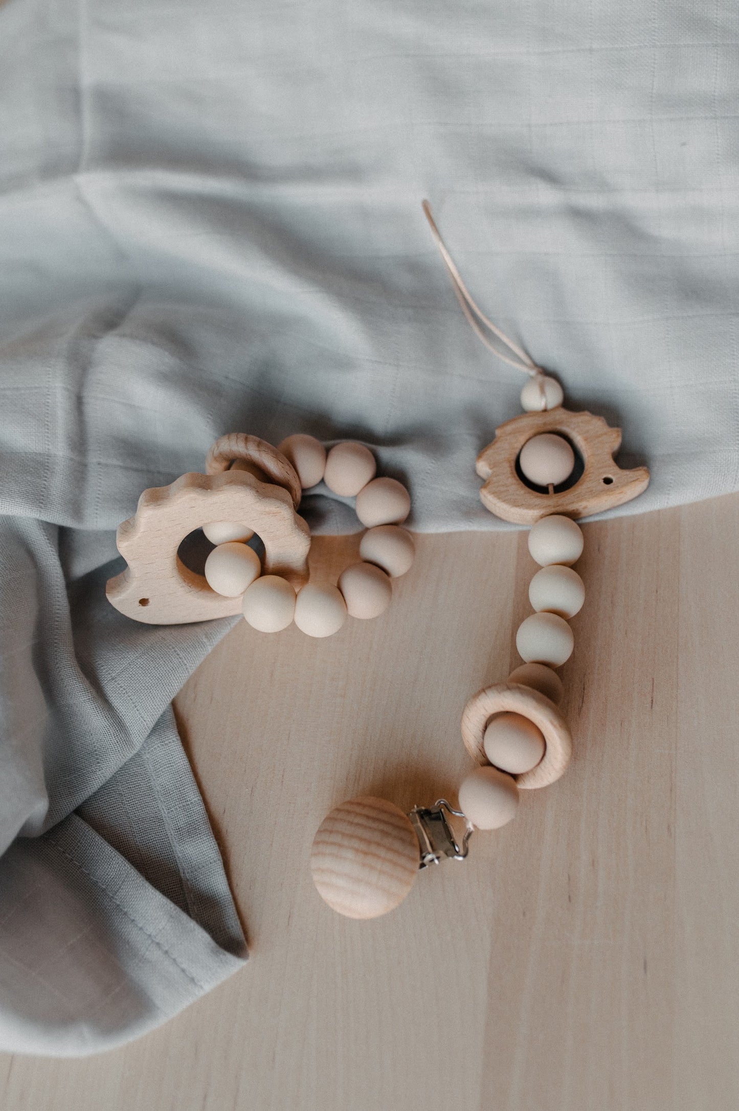 Pacifier holder and teething ring