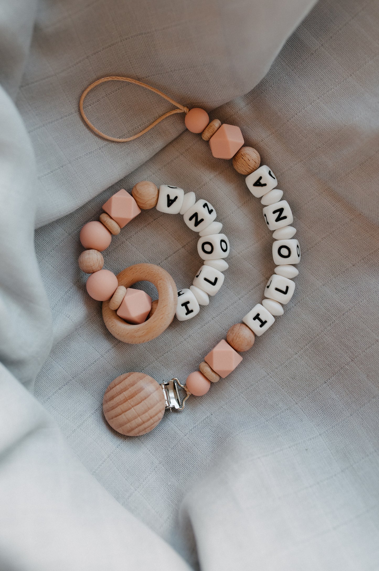 Personalized pacifier holder and personalized teething ring
