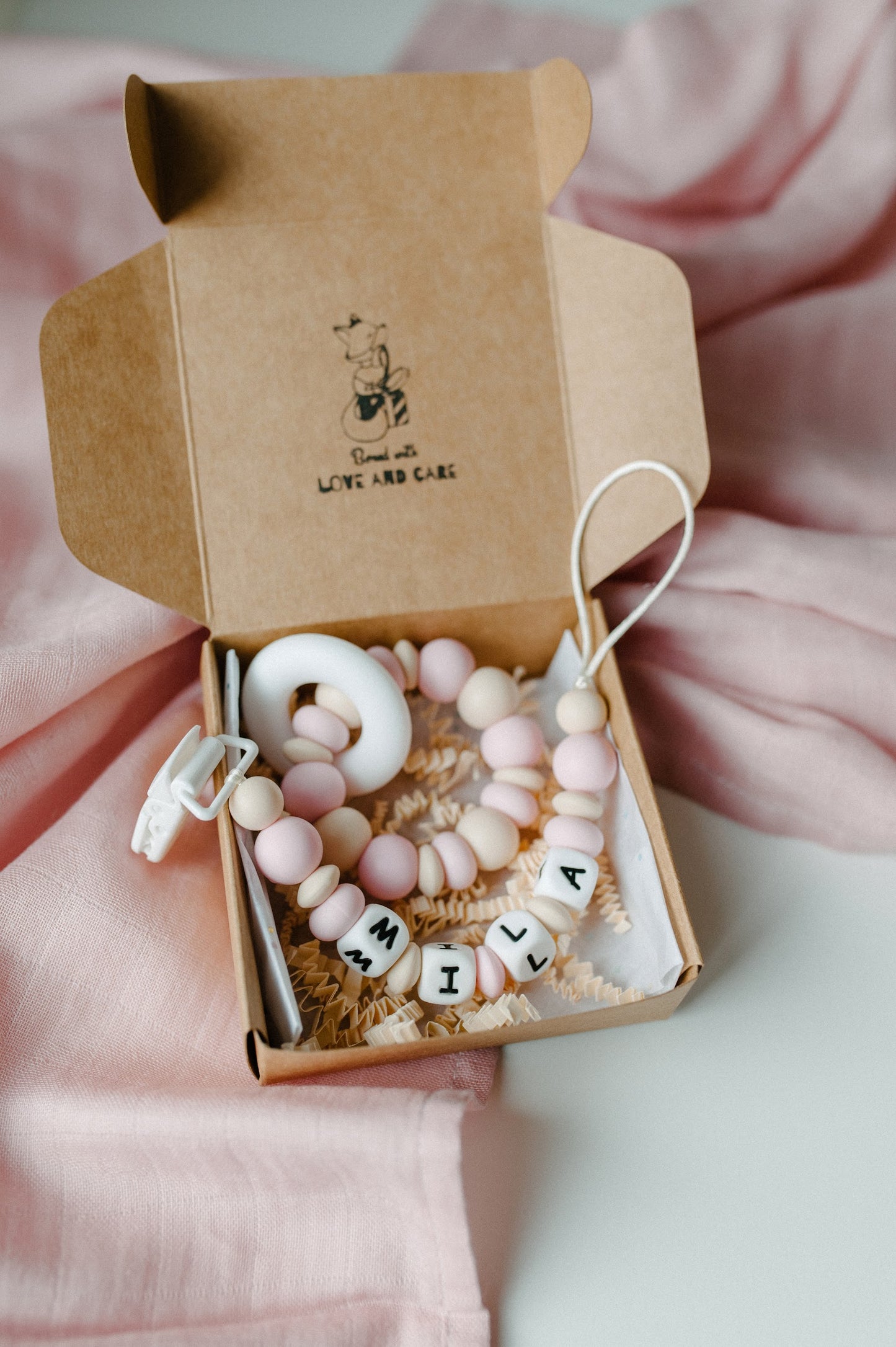 Personalized pacifier holder and teething ring